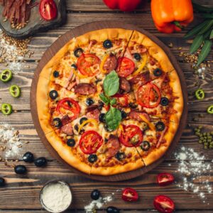 pizza-pizza-filled-with-tomatoes-salami-and-olives-min